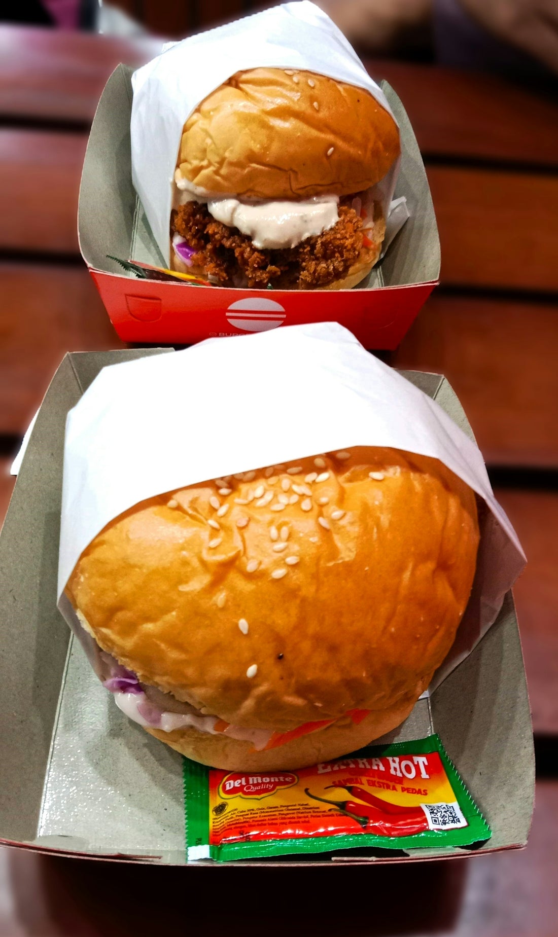 a close up of a sandwich in a box on a table