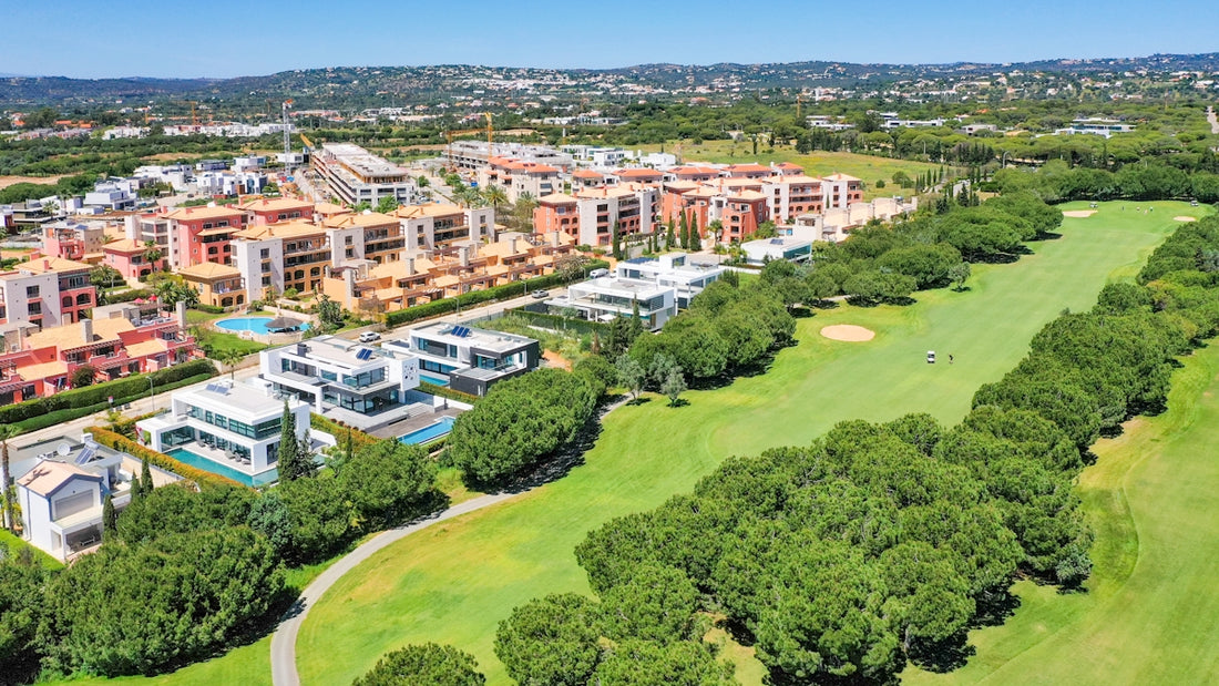 an aerial view of a golf course and buildings