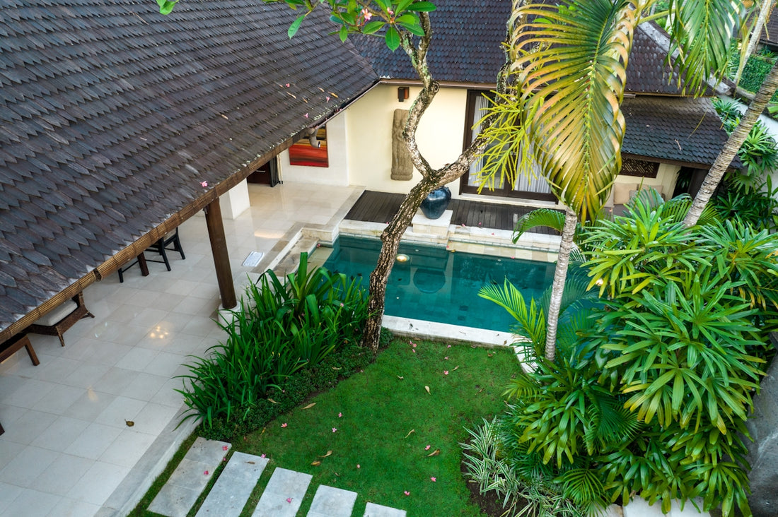A house with a pool in the middle of it
