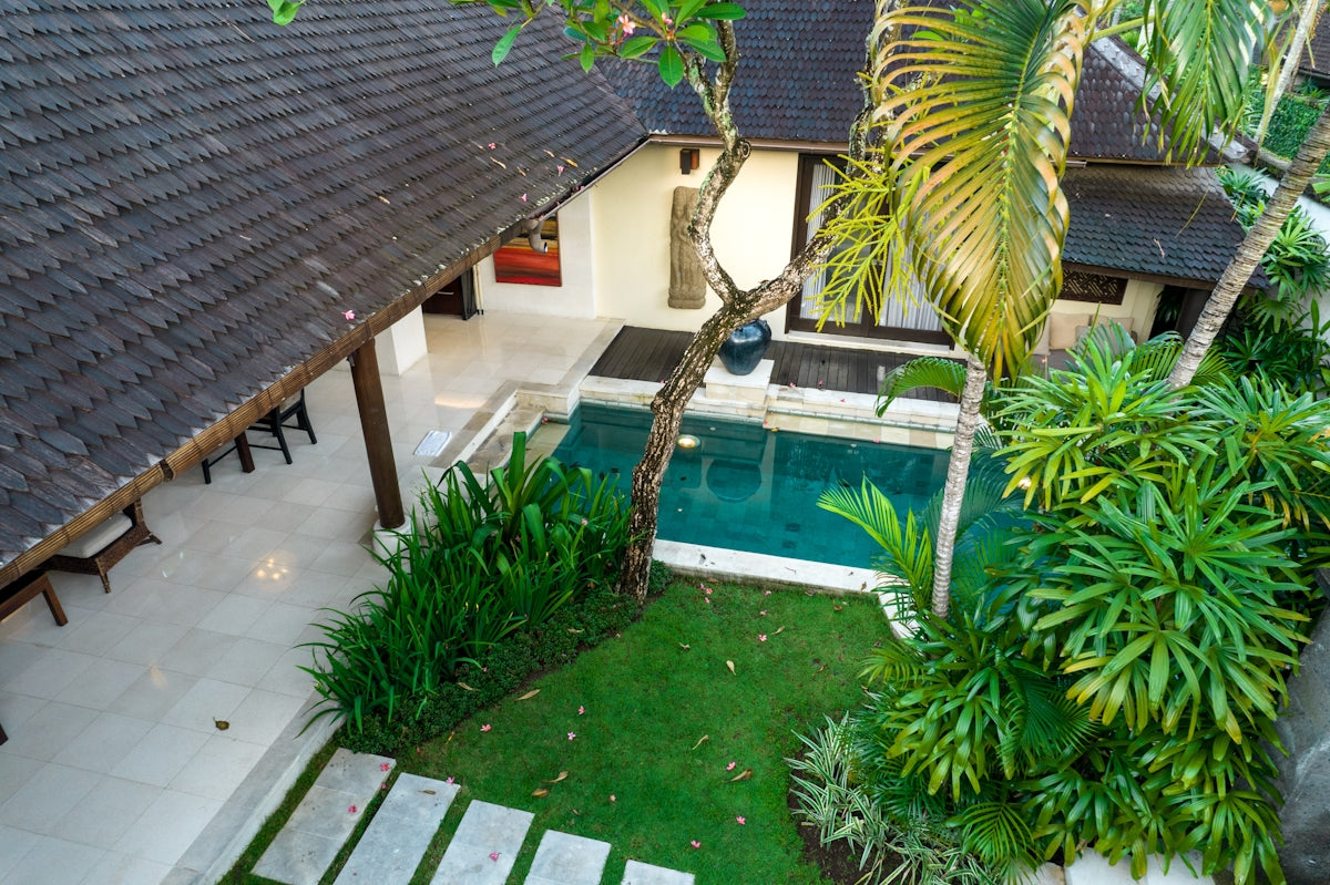 A house with a pool in the middle of it