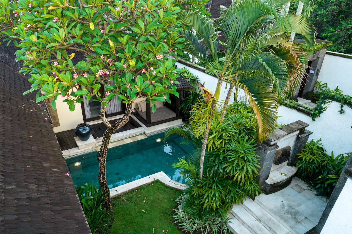 An aerial view of a house with a pool