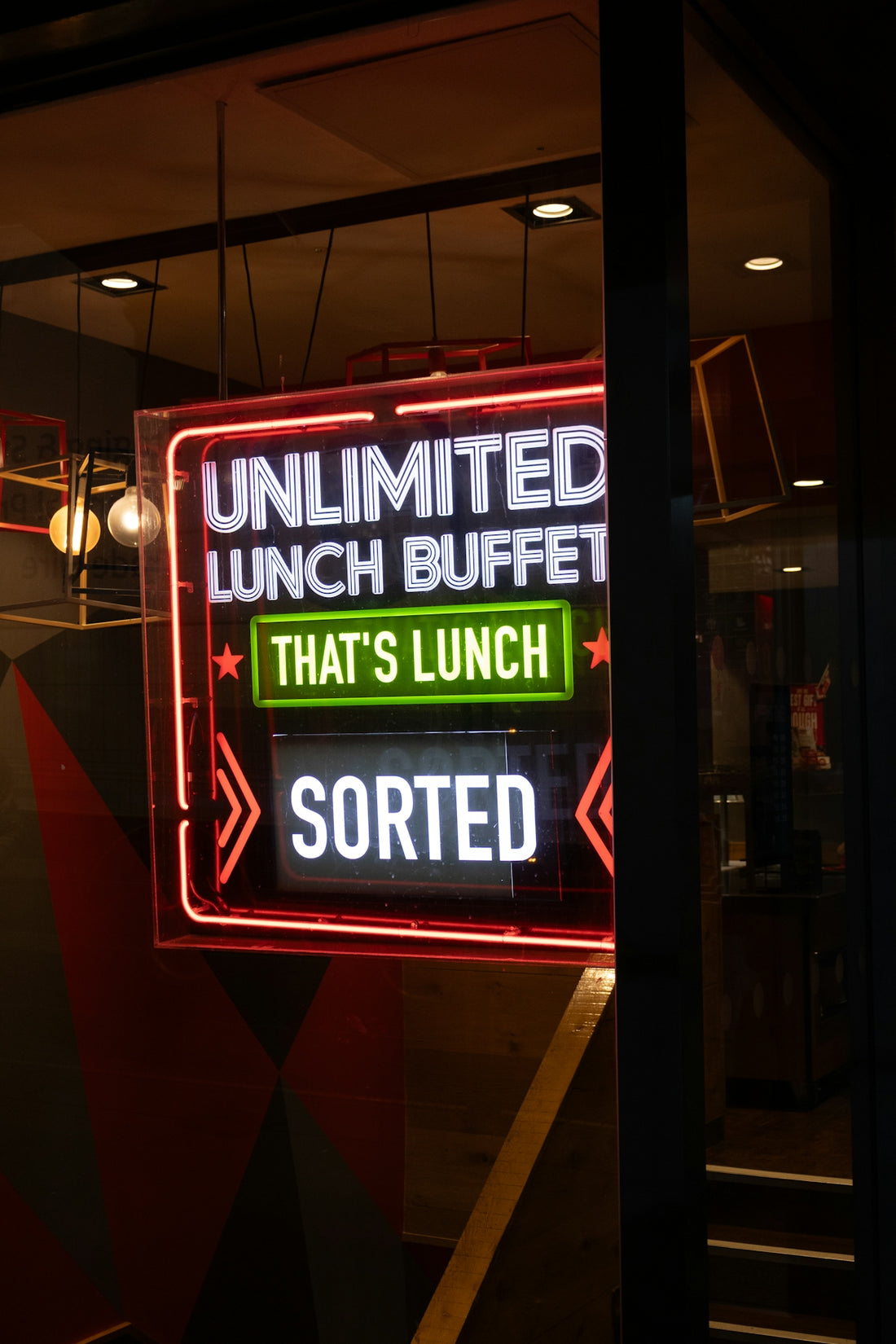 Neon sign advertises unlimited lunch buffet
