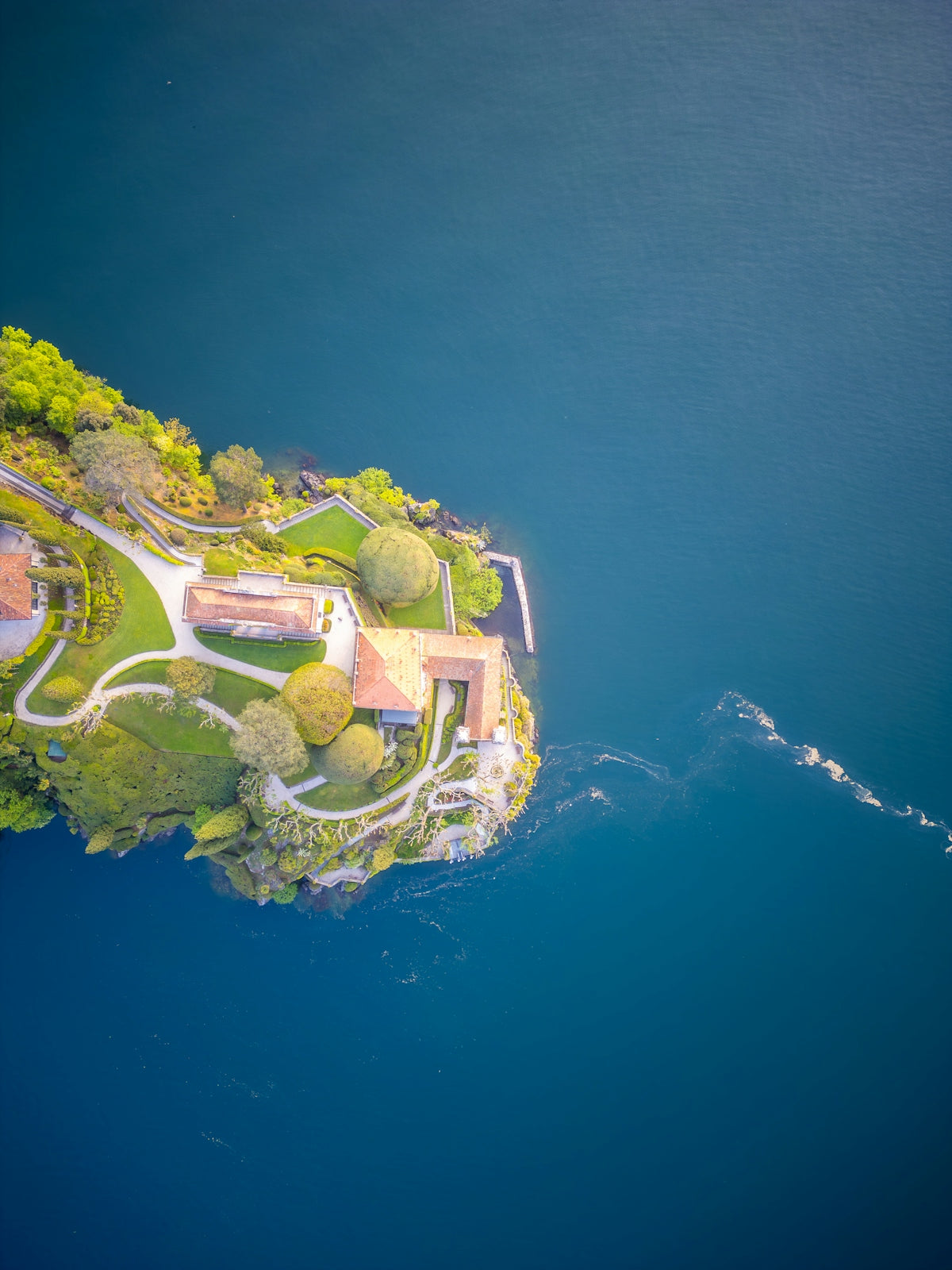 Aerial view of a house on a small island.