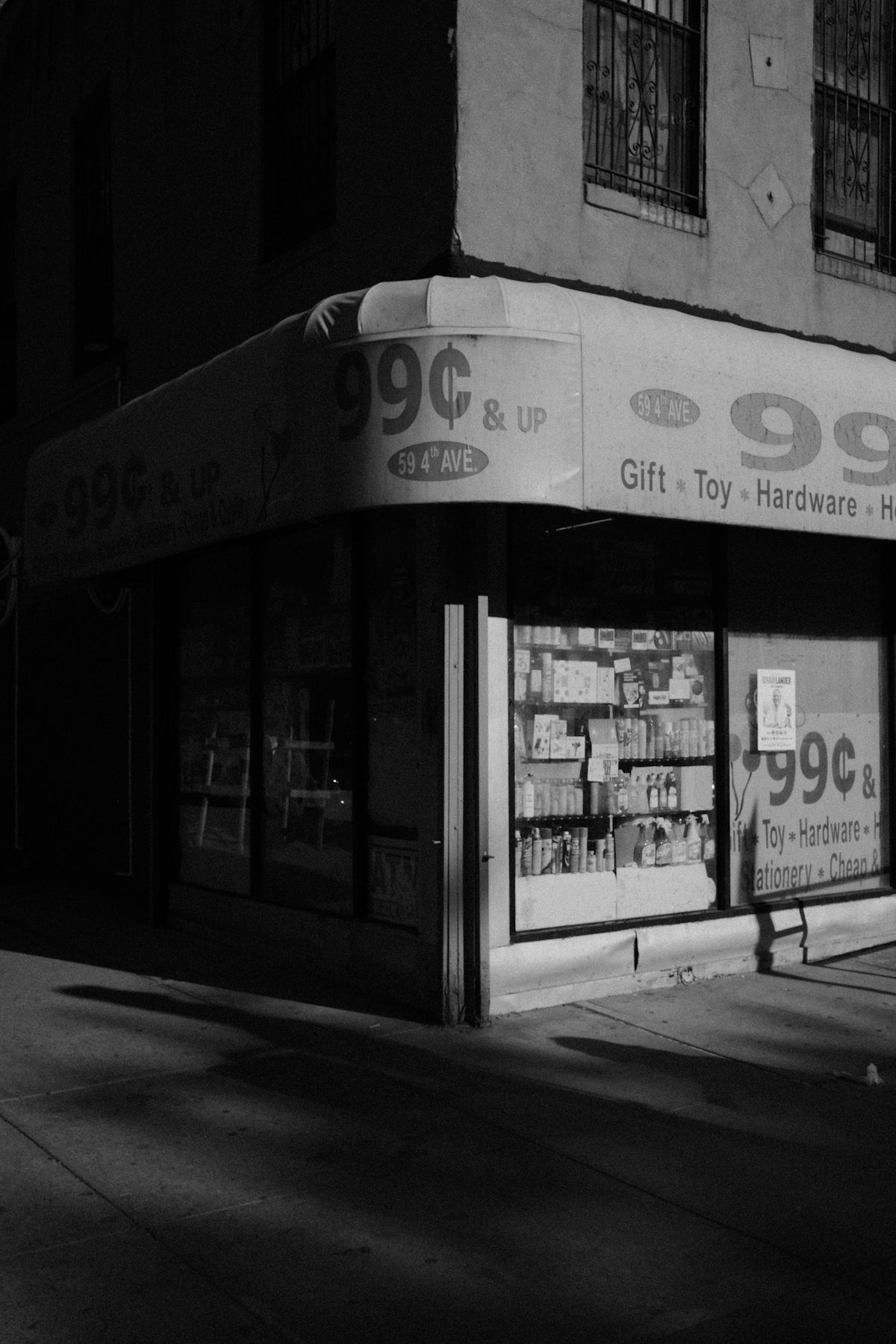 Black and white corner store with a 99-cent awning.